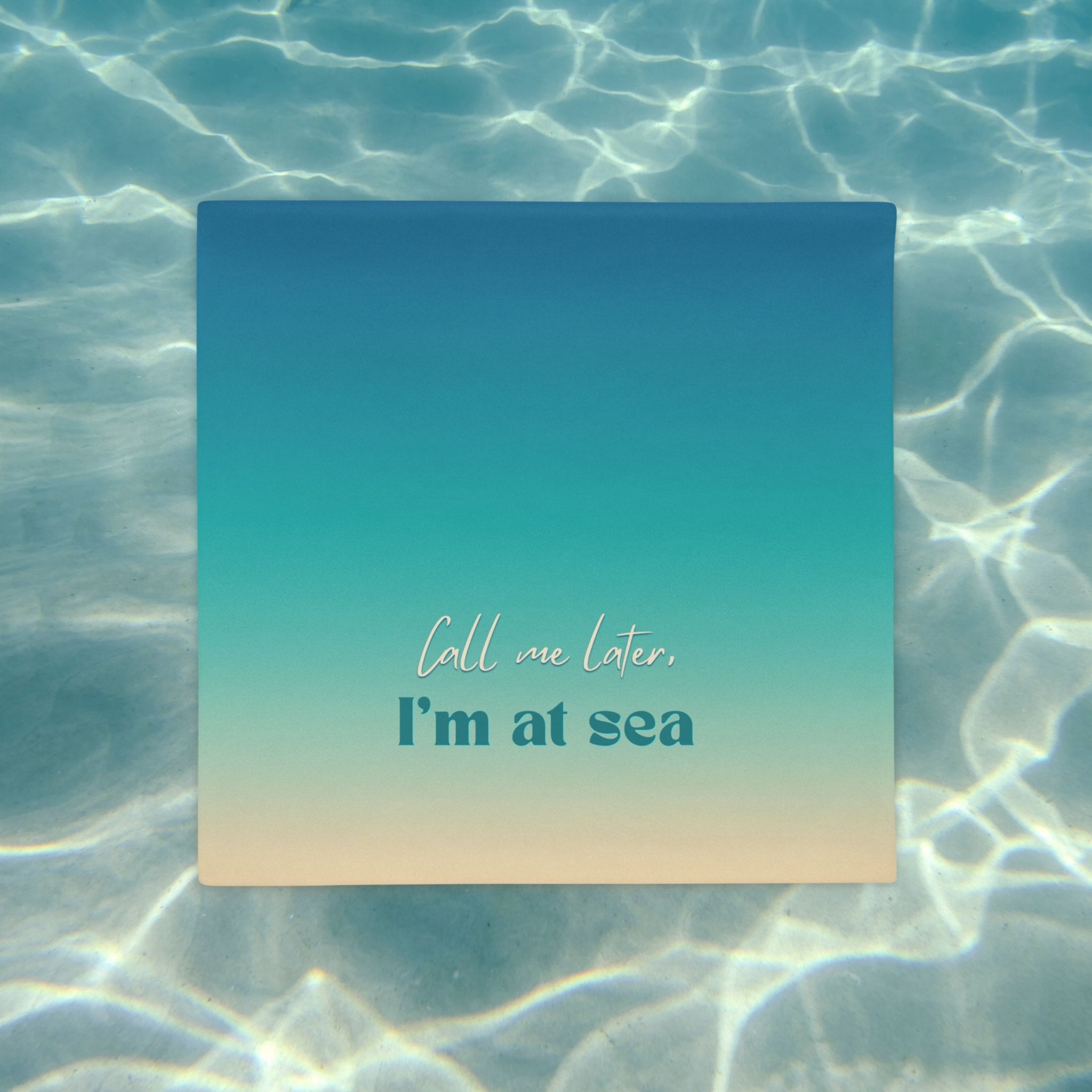 Square pillow case with 'Call me later, I'm at sea' text on a water background