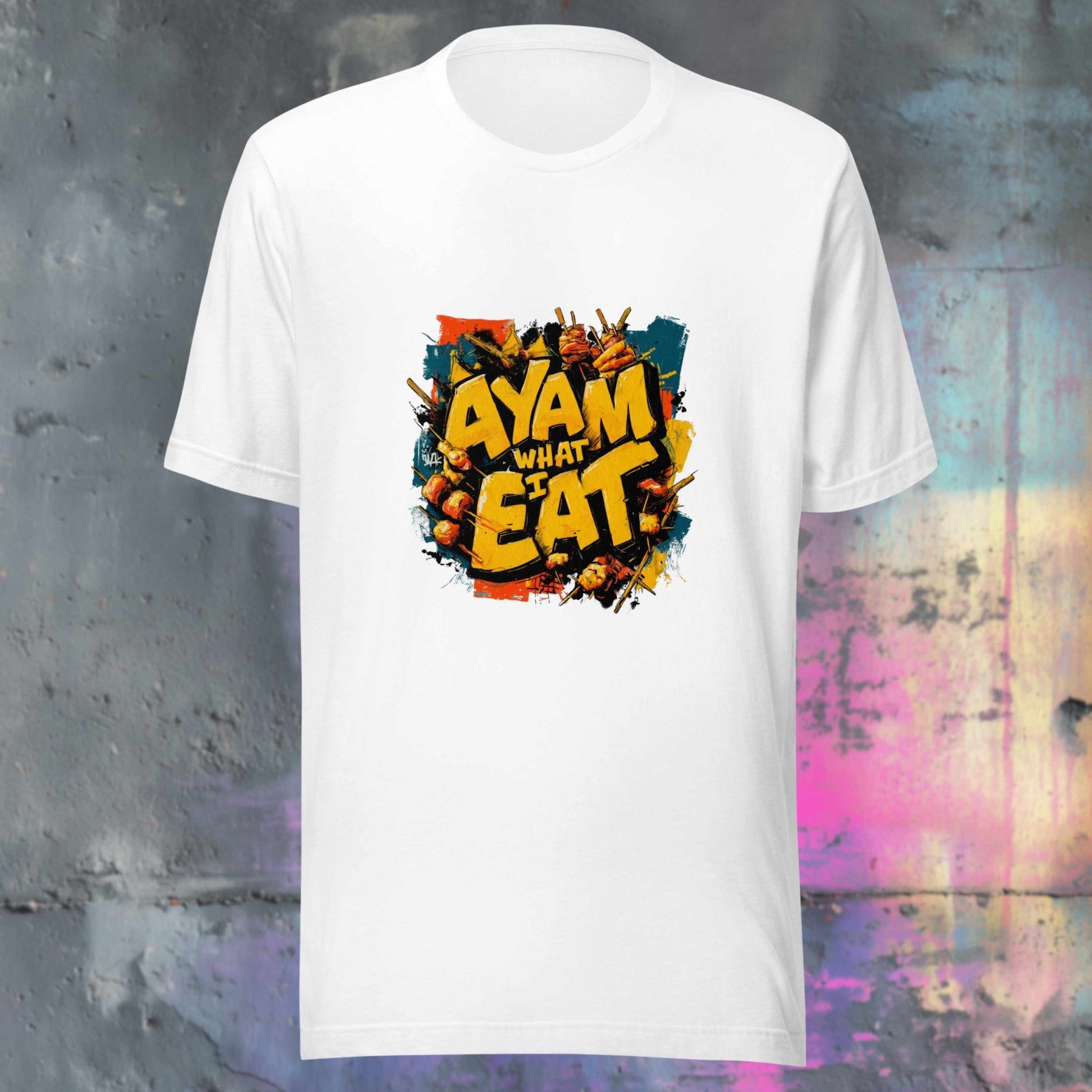 White t-shirt with colorful graffiti design on a textured background and Ayam what I eat slogan