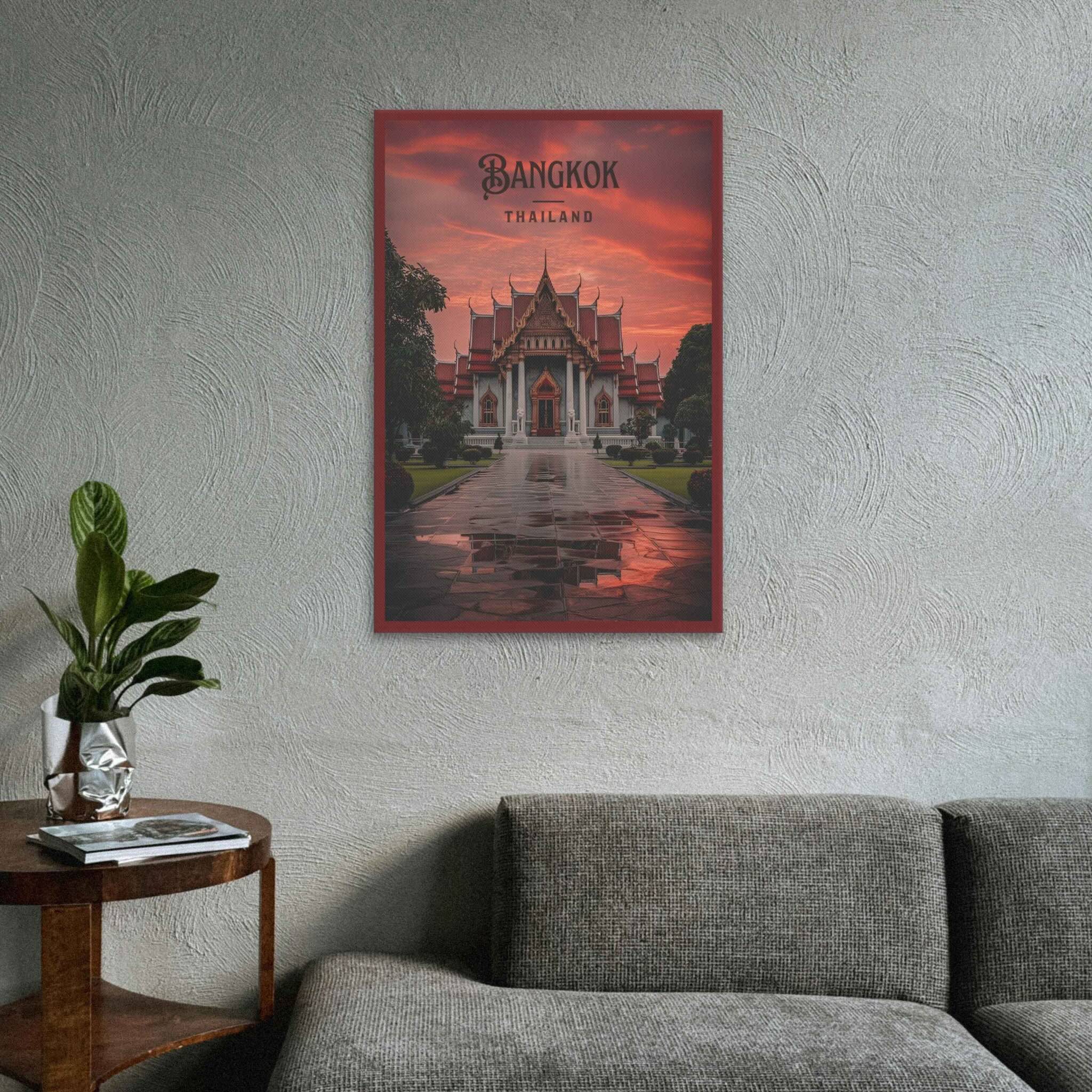 Poster of a temple in Bangkok, Thailand on a wall above a sofa.