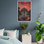 Poster of a temple in Bangkok on a wall above a bed with plants and a nightstand.