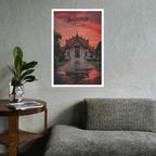 Poster of a temple in Bangkok on a wall above a sofa and side table.