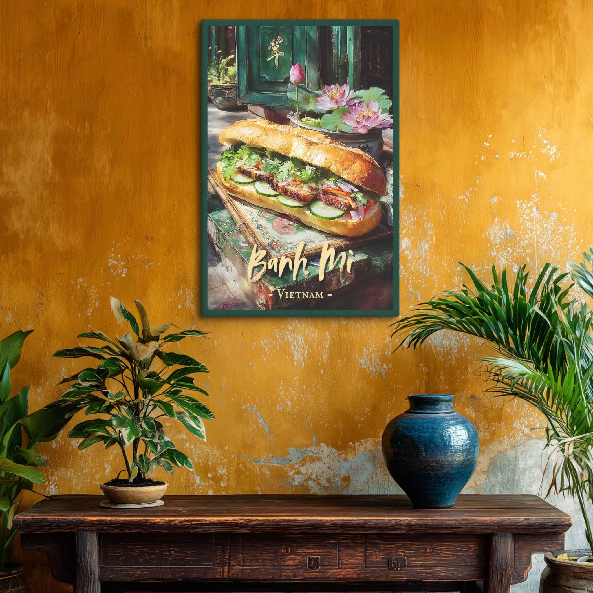 Framed artwork of a Banh Mi sandwich on a textured yellow wall with plants and a vase.
