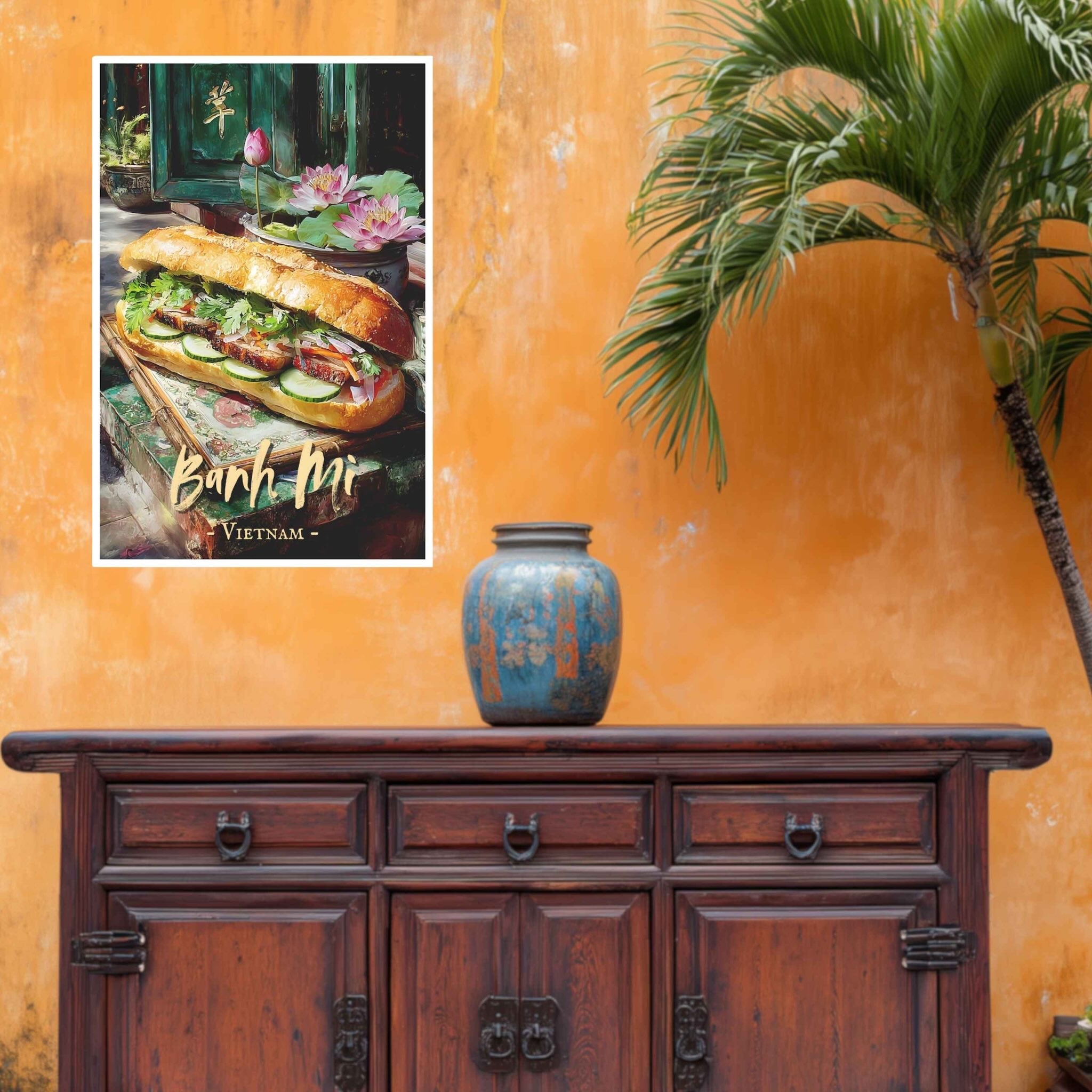 Poster of a bánh mì with 'Banh Mi Vietnam' text on an orange wall with a wooden cabinet and vase.