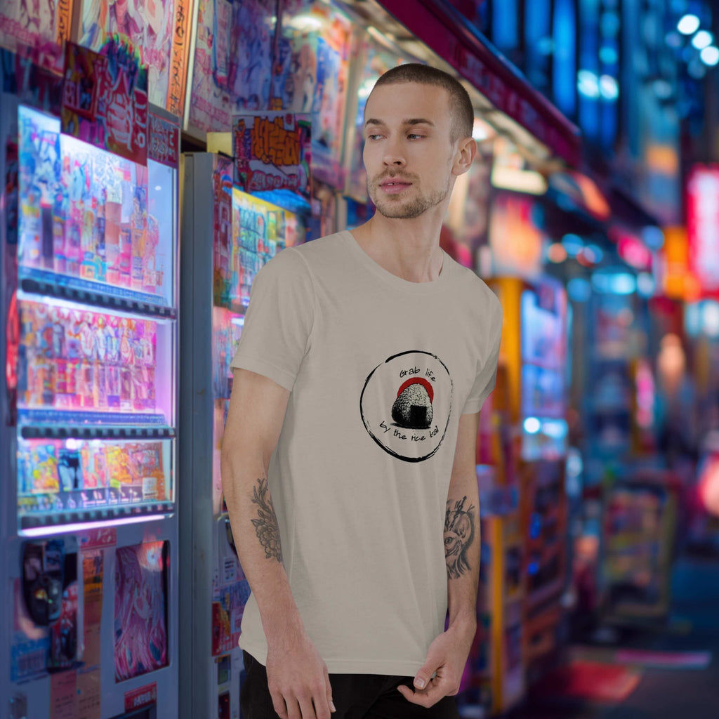 Man standing in front of a colorful vending machine display wearing Grab Life by the Rice Ball onigiri front print t-shirt