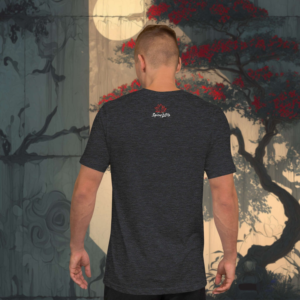 Man wearing a black t-shirt with a logo standing in front of a japanese stylized tree painting.