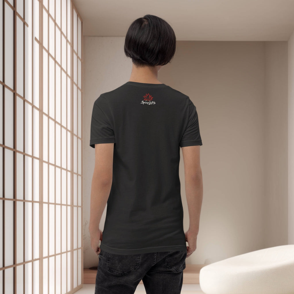 Person wearing a black t-shirt with a logo in a minimalistic room.