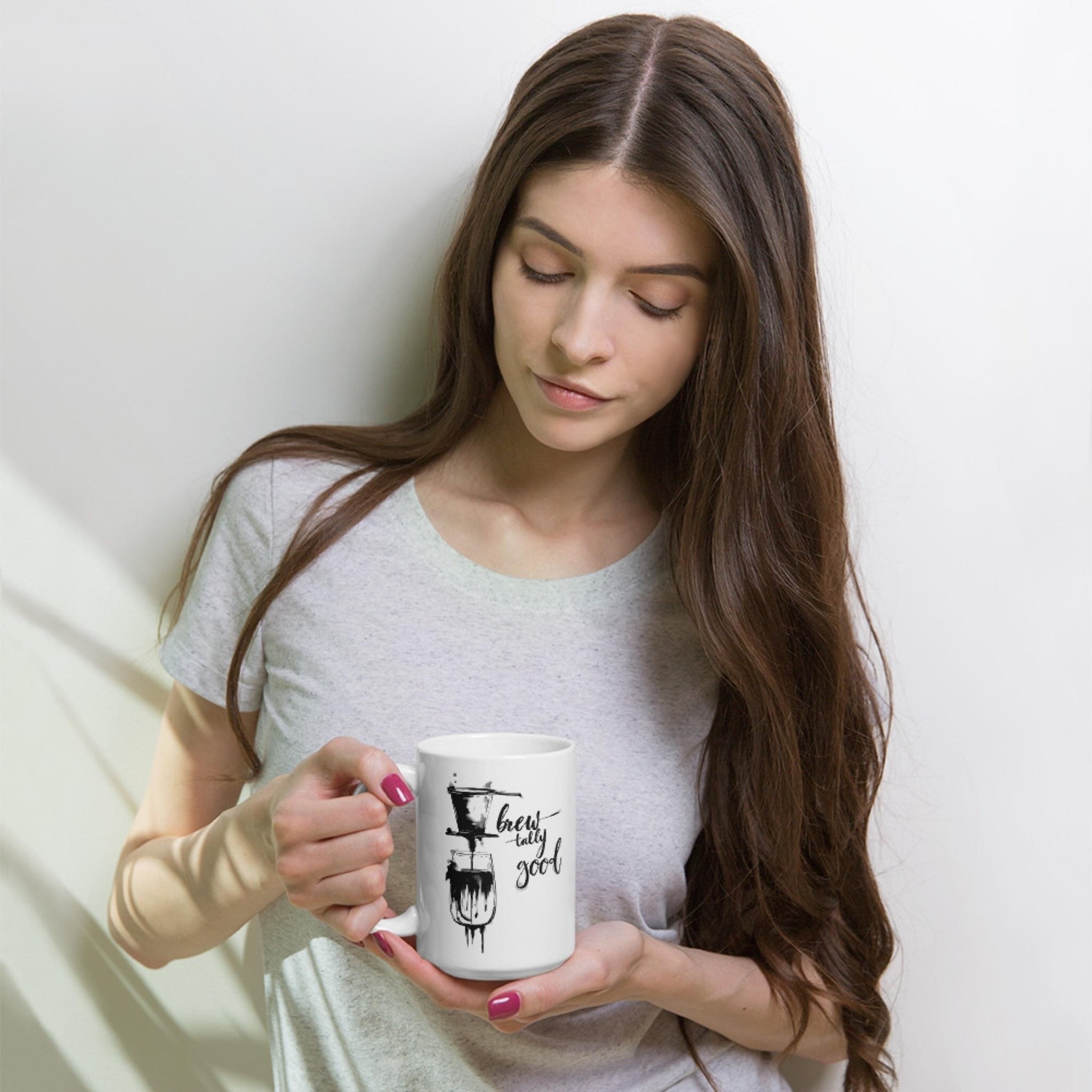 Woman holding a 15 oz brewtally Good Vietnamese phin coffee mug, enjoying morning coffee