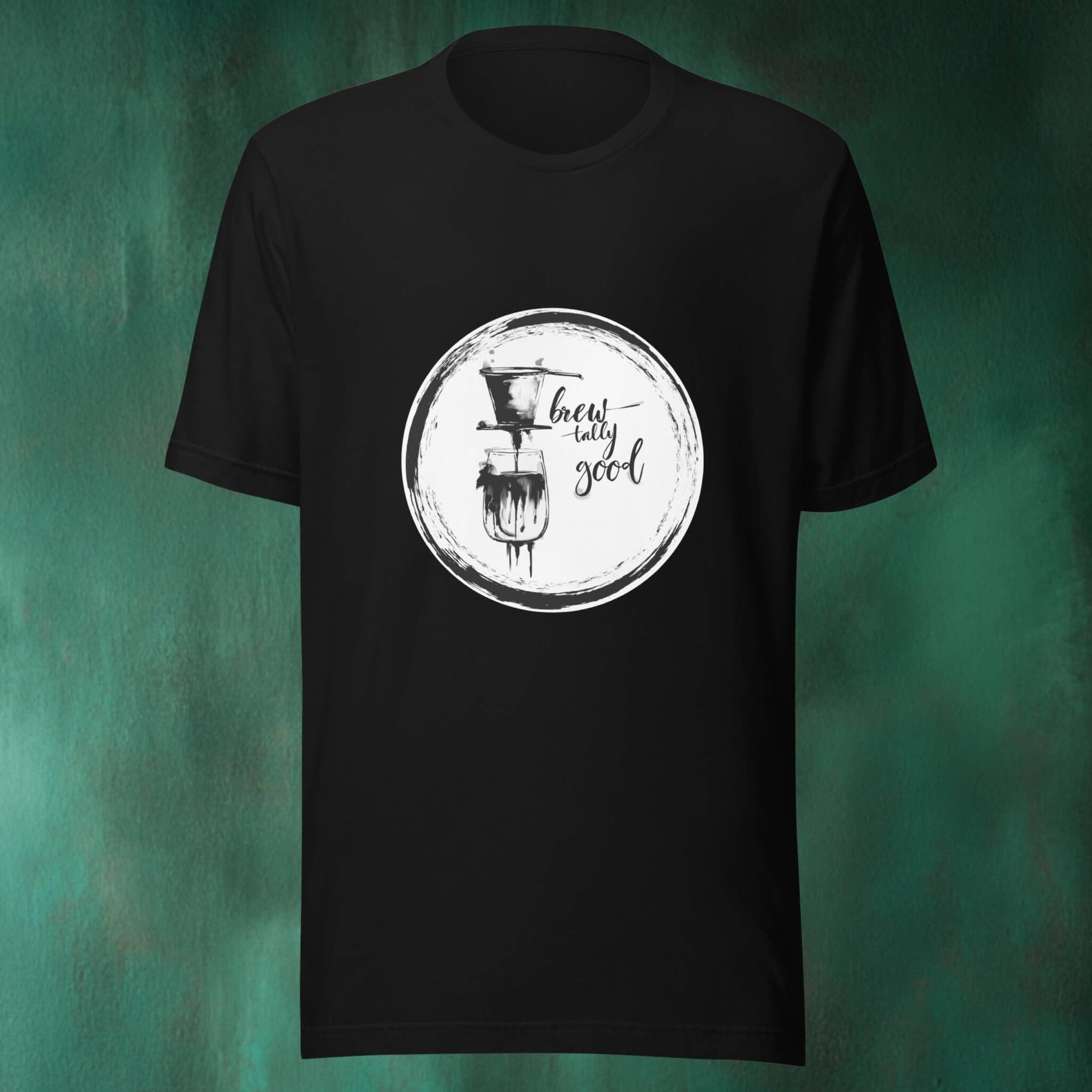 Black t-shirt with a white coffee graphic design on a green textured background