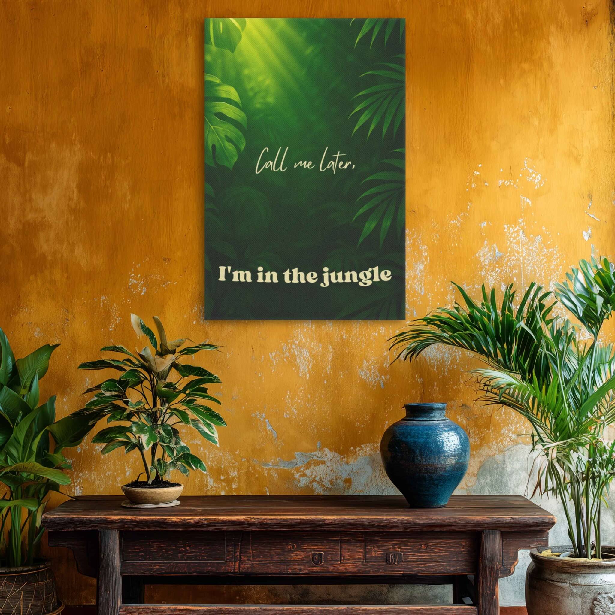 Decorative wall art with tropical leaves and text on a textured yellow wall with plants and a vase.
