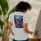 Chill Nomads Midnight Reef Backprint T-Shirt on a woman standing in front of an aesthetic wall with lush plants