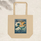 Beige tote bag with 'Spicy Lotus Surf Club' design on a light background