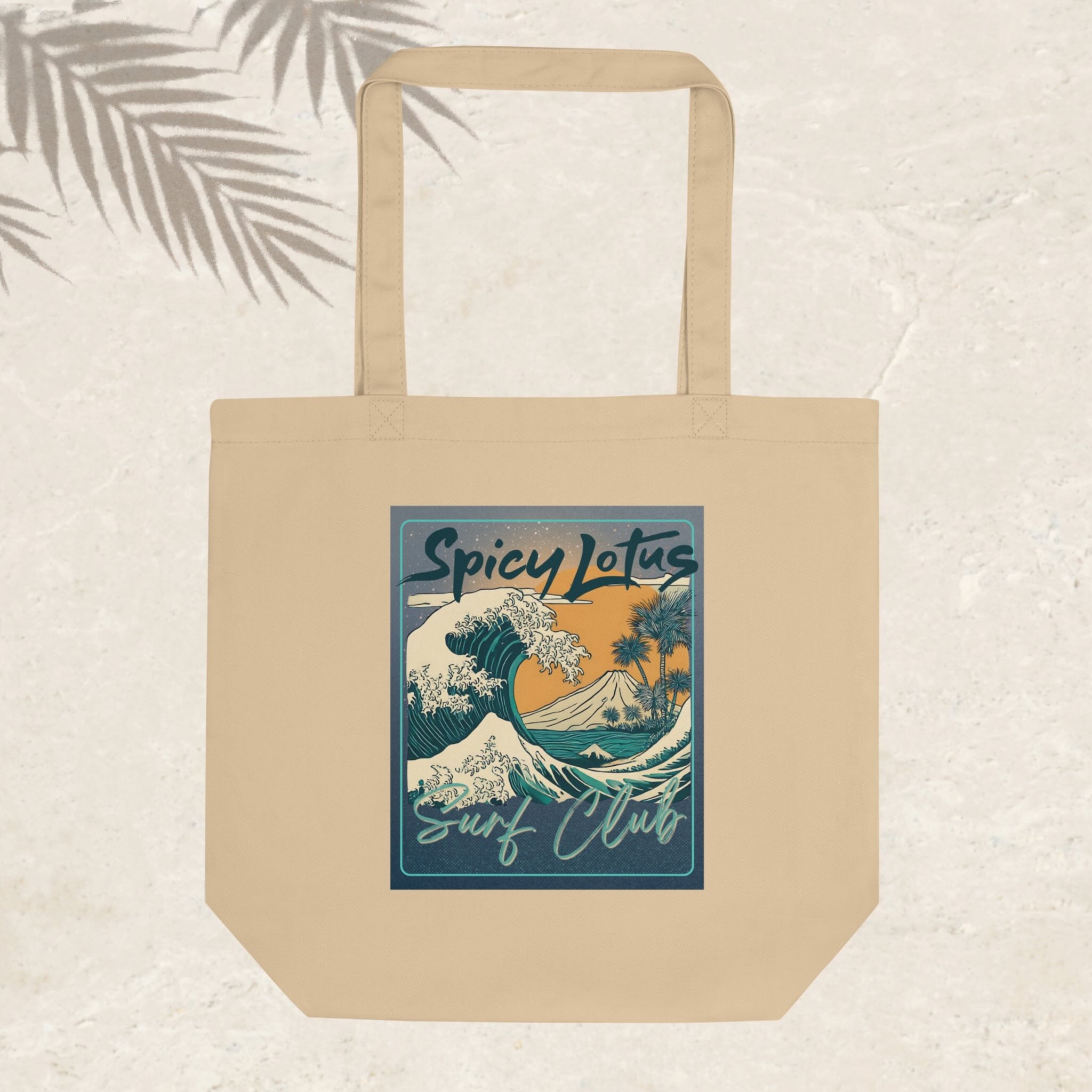Beige tote bag with 'Spicy Lotus Surf Club' design on a light background