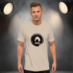 Man wearing a beige t-shirt with a graphic design of japanese onigiri 'grab life by the rice ball' on a gray background