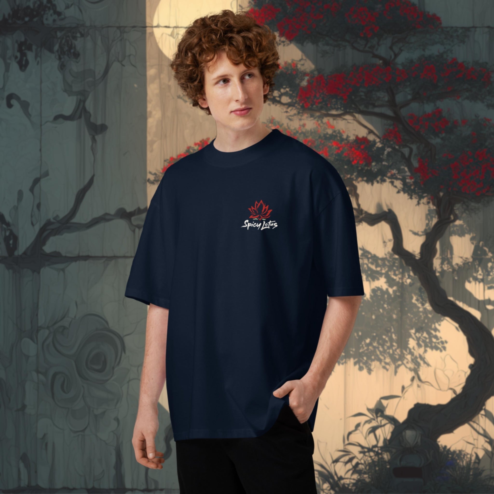 Person wearing an oversozed navy blue t-shirt with a logo and brand name, standing against an artistic background.