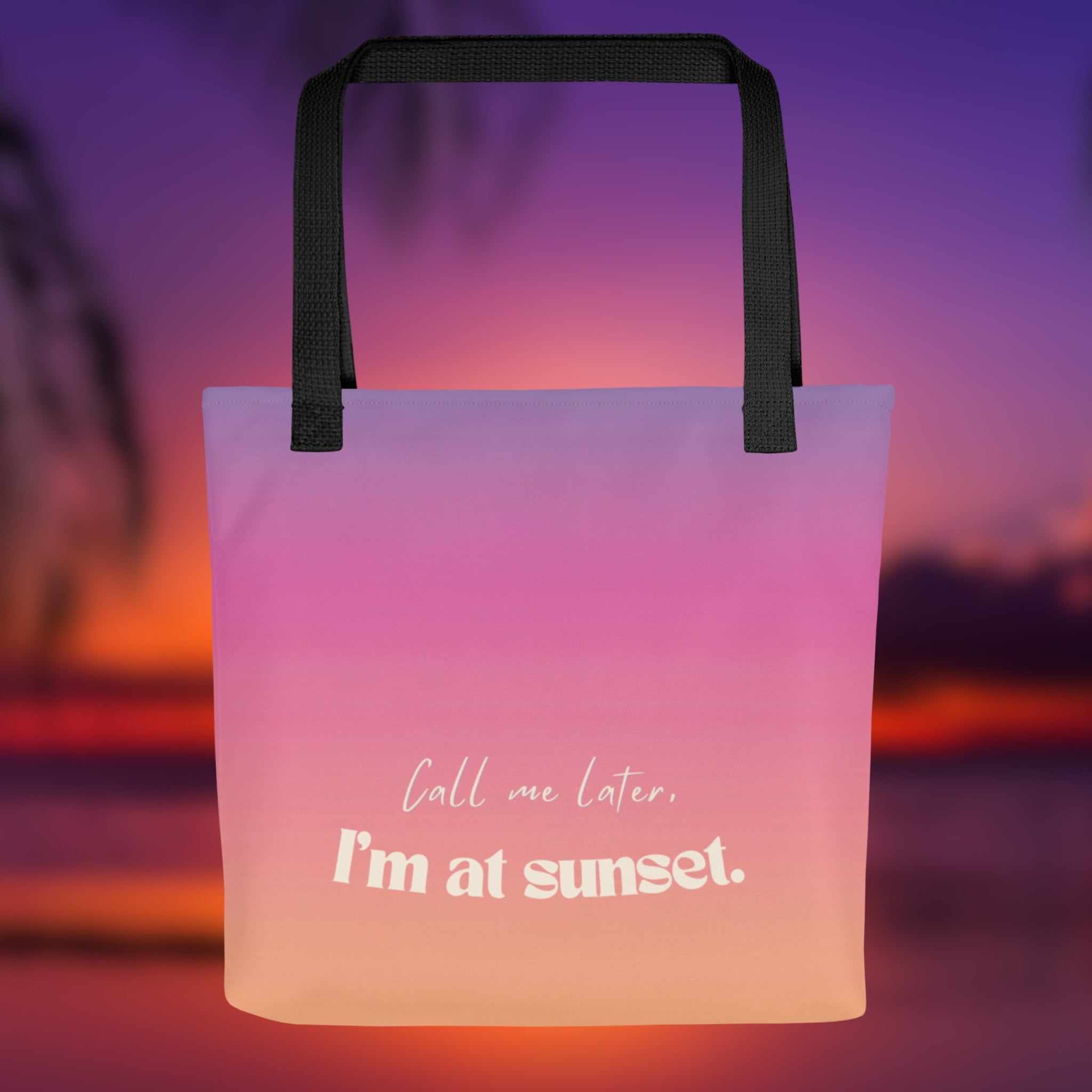 Tote bag with 'Call me later, I'm at sunset' text against a sunset background