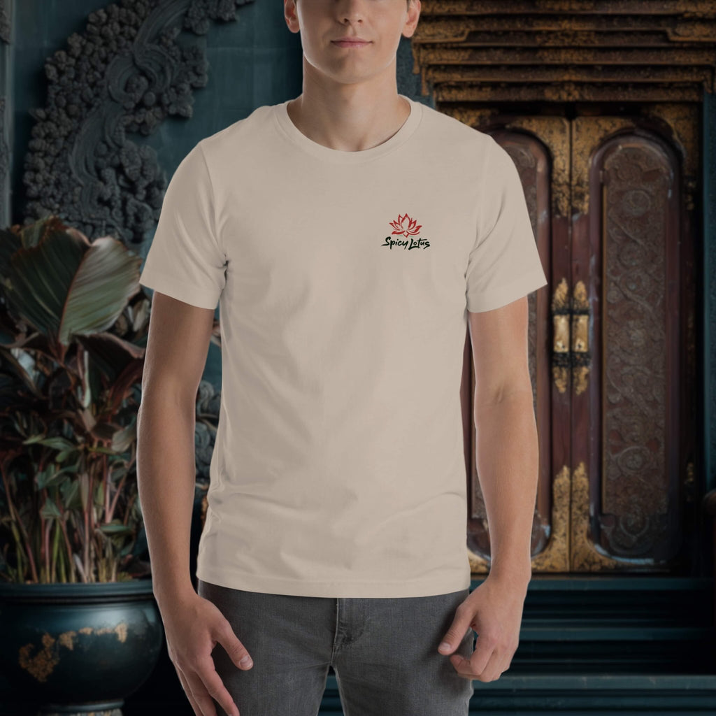 Person wearing a beige t-shirt with a logo in front of decorative wall art