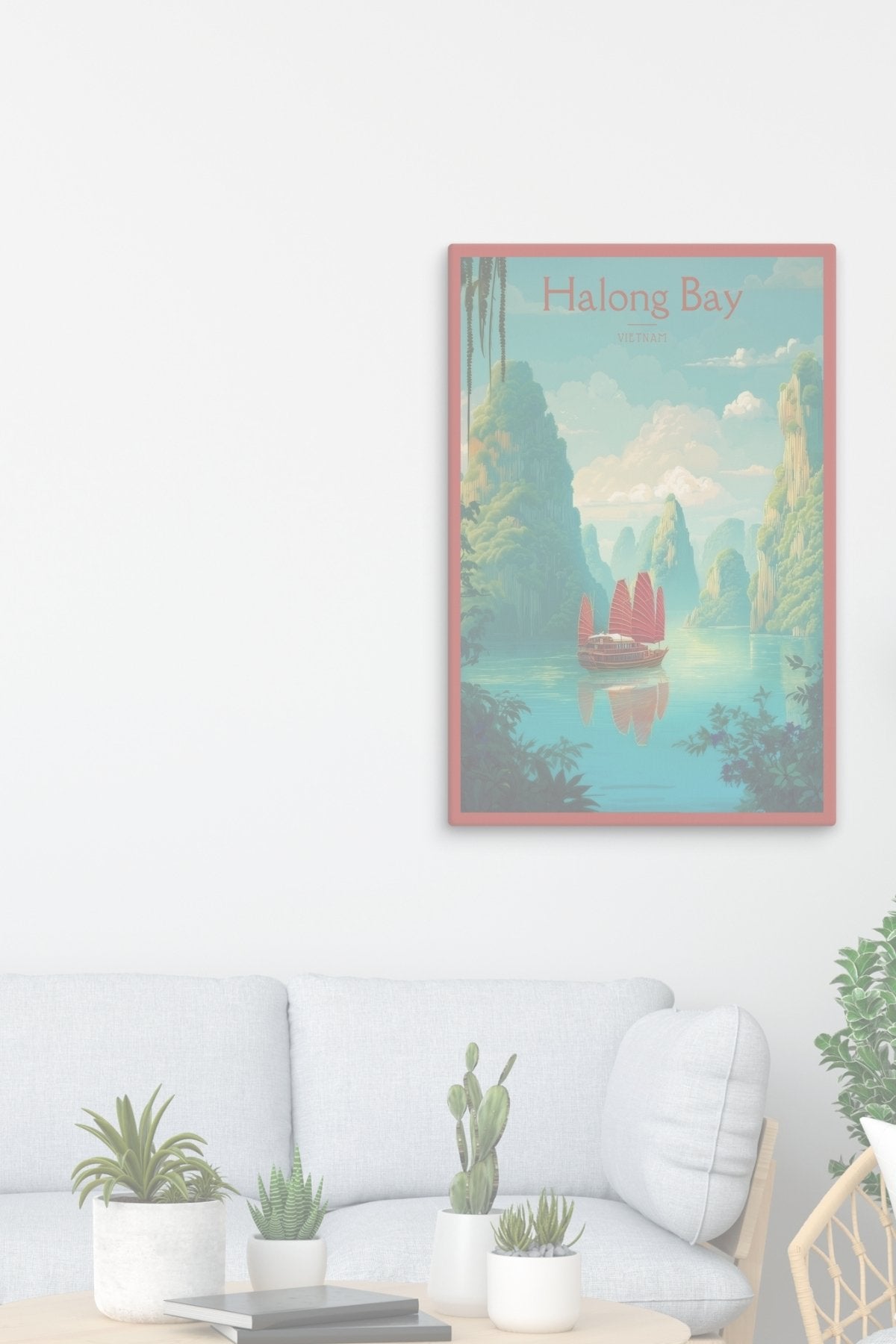 Canva artwork of a scenic Halong Bay landscape on a white wall above a sofa.