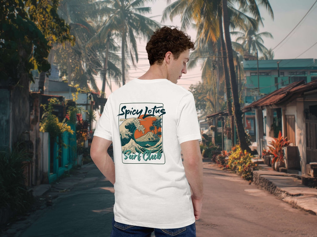 Spicy Lotus Surf Club Sunrise Wave back print T-shirt on a young man standing on a street in Bali