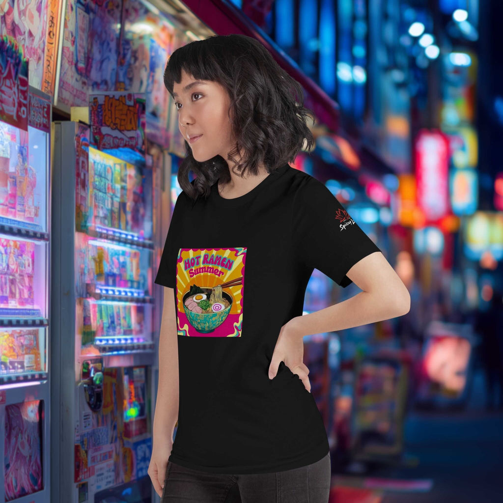 Person wearing a black t-shirt with a colorful ramen graphic design in front of a vibrant, neon-lit arcade.