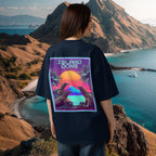 Female woman wearing a  10 % cotton navy blue t-shirt with 'Island Dons' design, standing in front of a scenic mountain and ocean view at Komodo Island