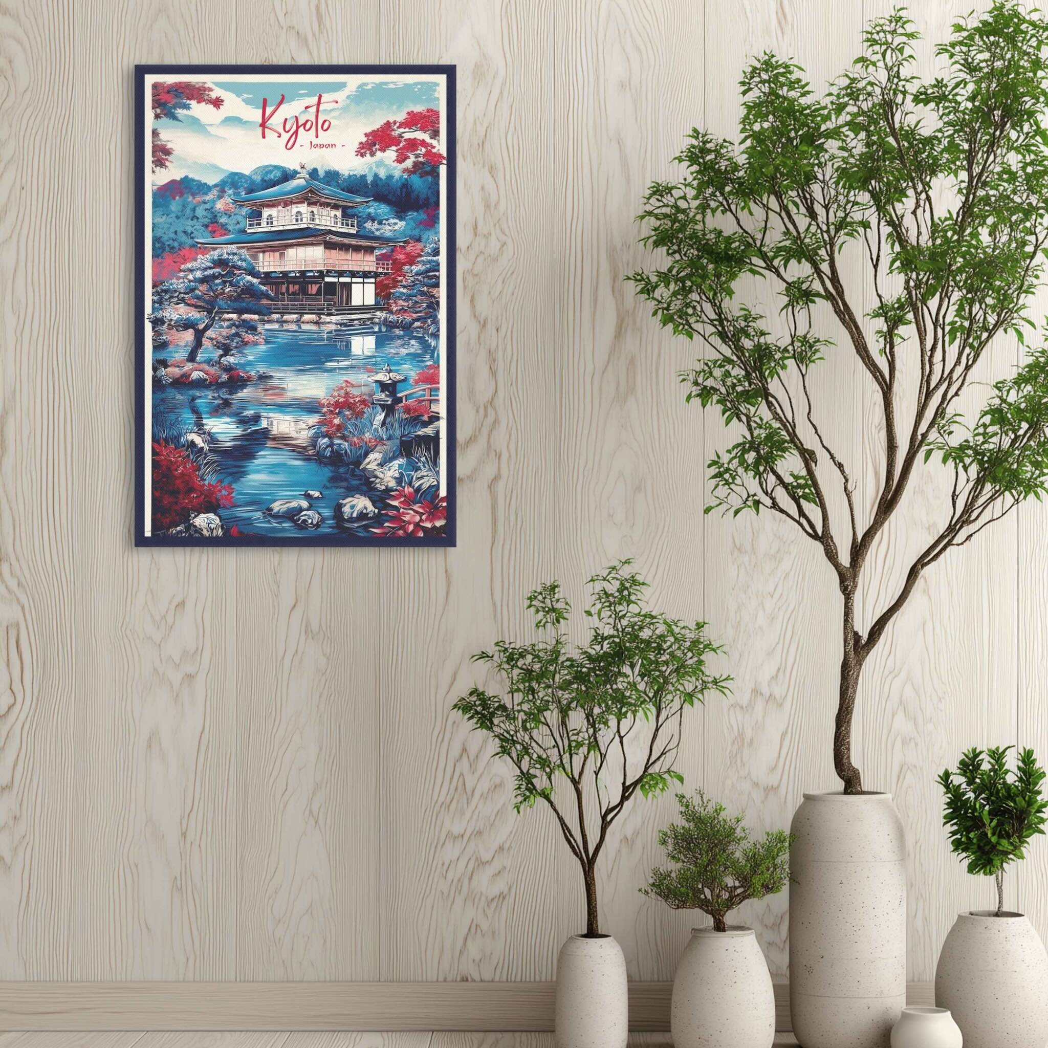 Framed artwork of a Kyoto scene on a wall with decorative plants.