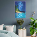 Framed artwork of a tropical beach scene on a gray wall above a bed.