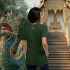 Person wearing a green t-shirt with a logo, standing in front of a temple with a dragon sculpture.