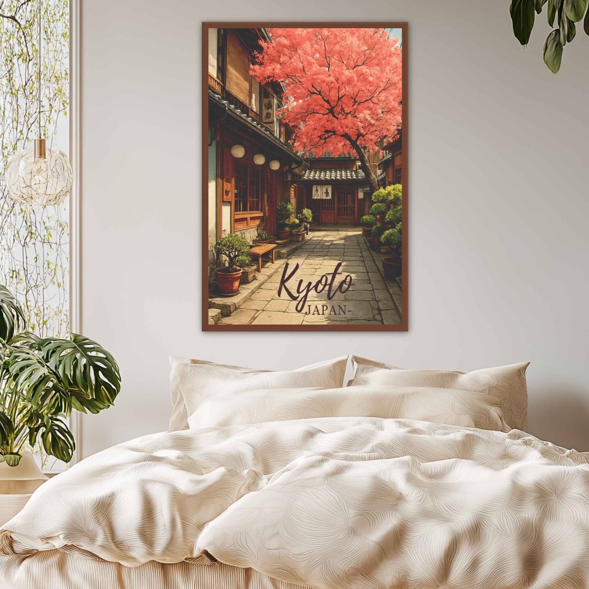 Poster of a street in Kyoto, Japan, above a bed in a bedroom.