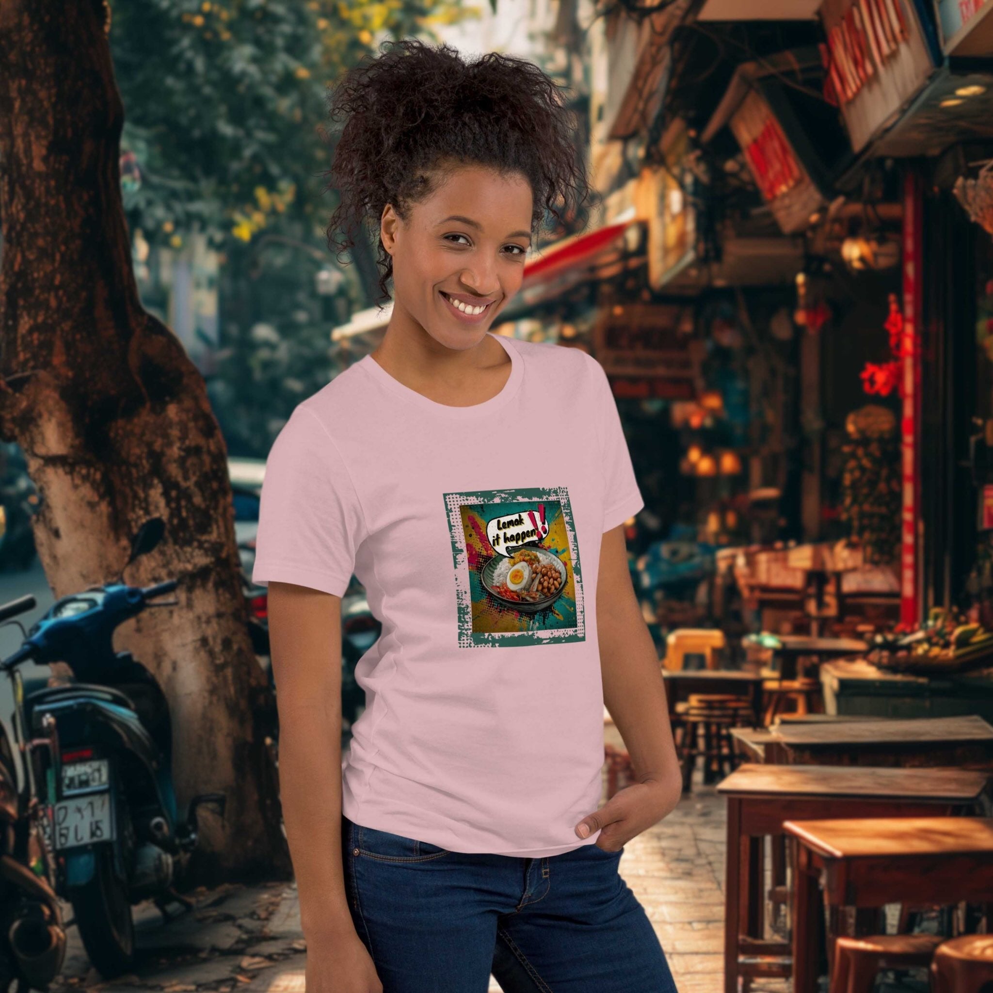 Woman wearing a pink t-shirt with a graphic design in an outdoor setting