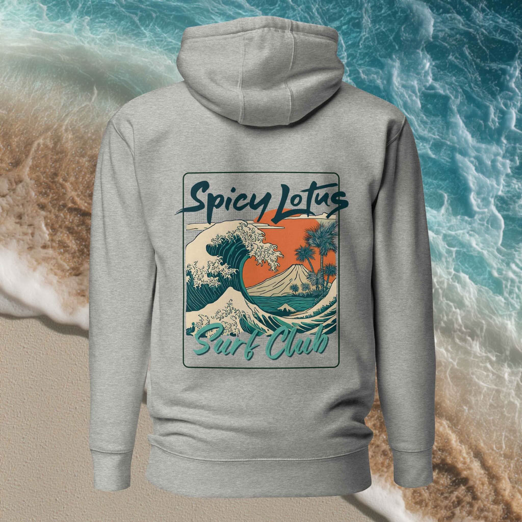 Close-up of bold tropical wave graphic on back DTG print on Ghost unisex hoodie, behind beach and waves