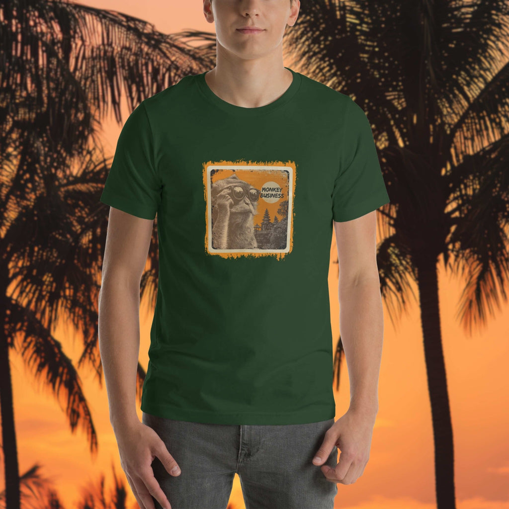 Monkey Business Bali macaque front print t-shirt on a man in front of beach orange and black silhouette