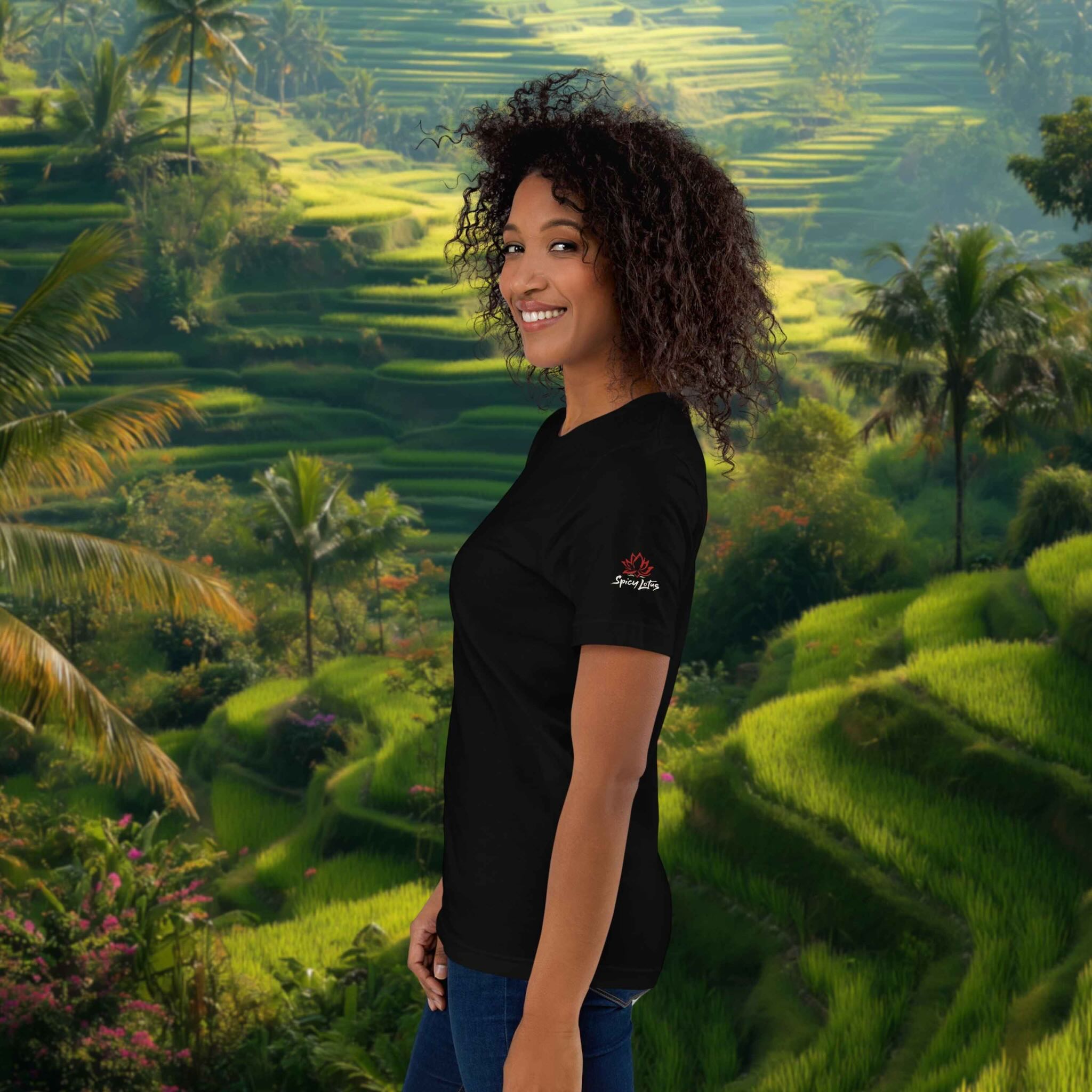Woman wearing a black t-shirt with a logo in front of green rice terraces