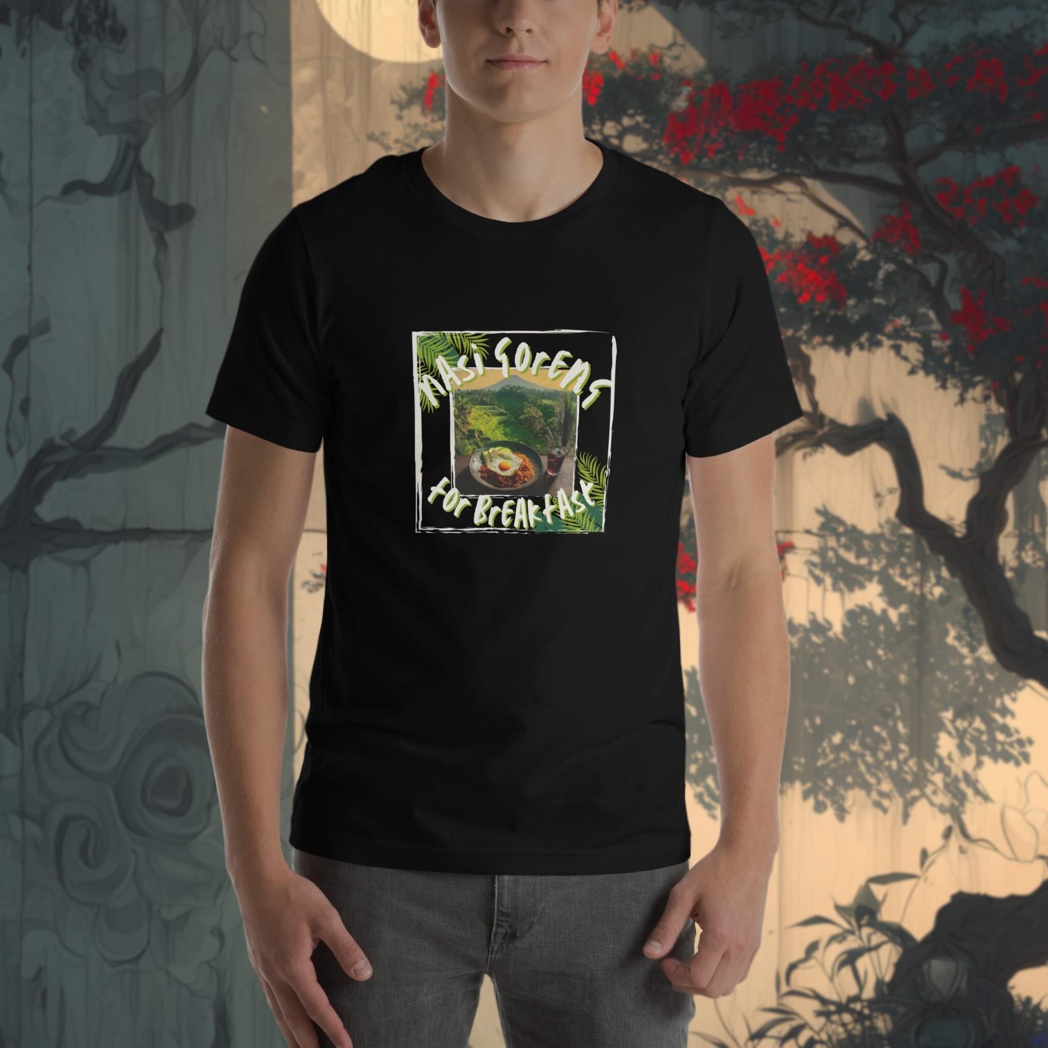 Person wearing a black t-shirt with a graphic design in front of a decorative wall.