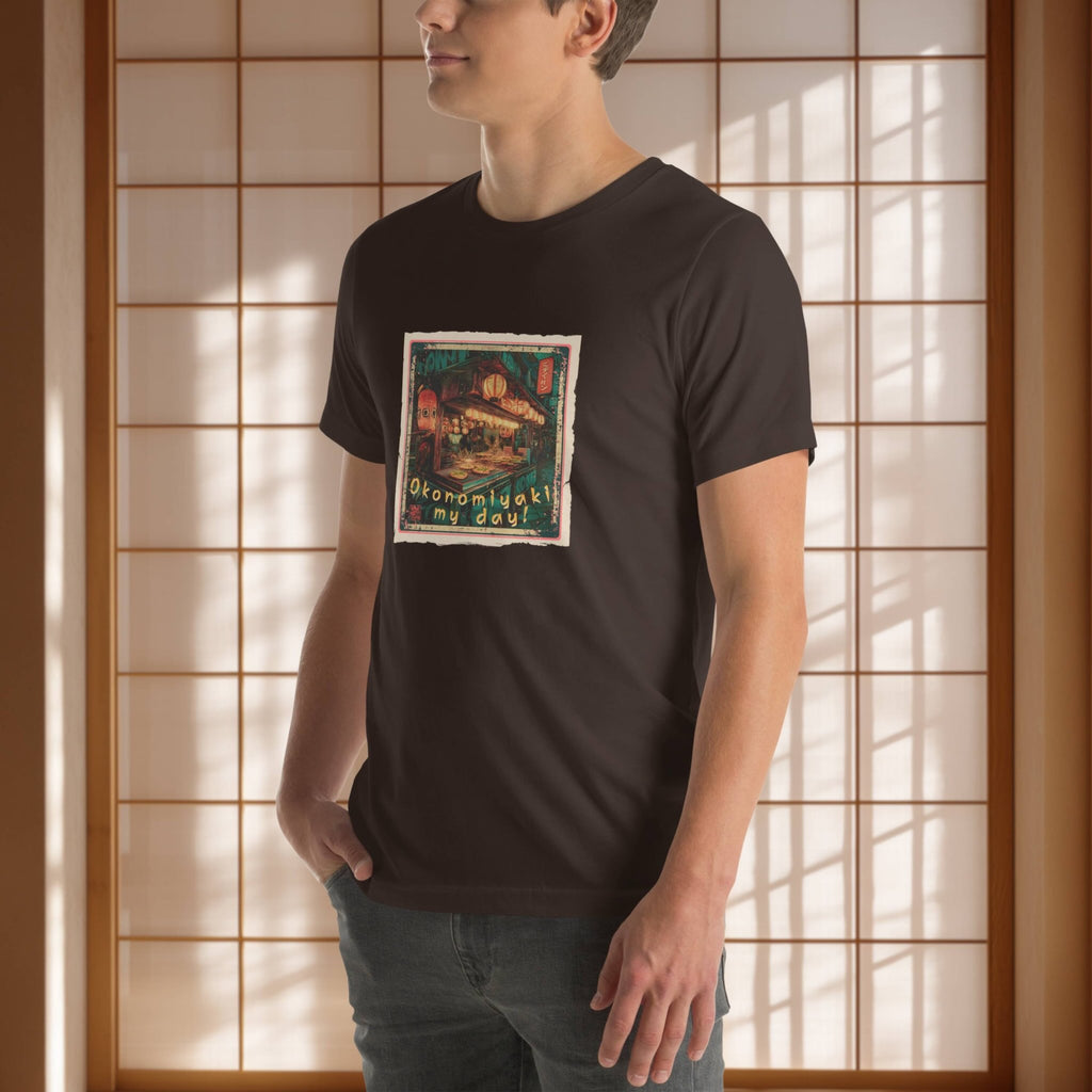 Person wearing a black t-shirt with a japanese graphic design in front of a wooden panel background