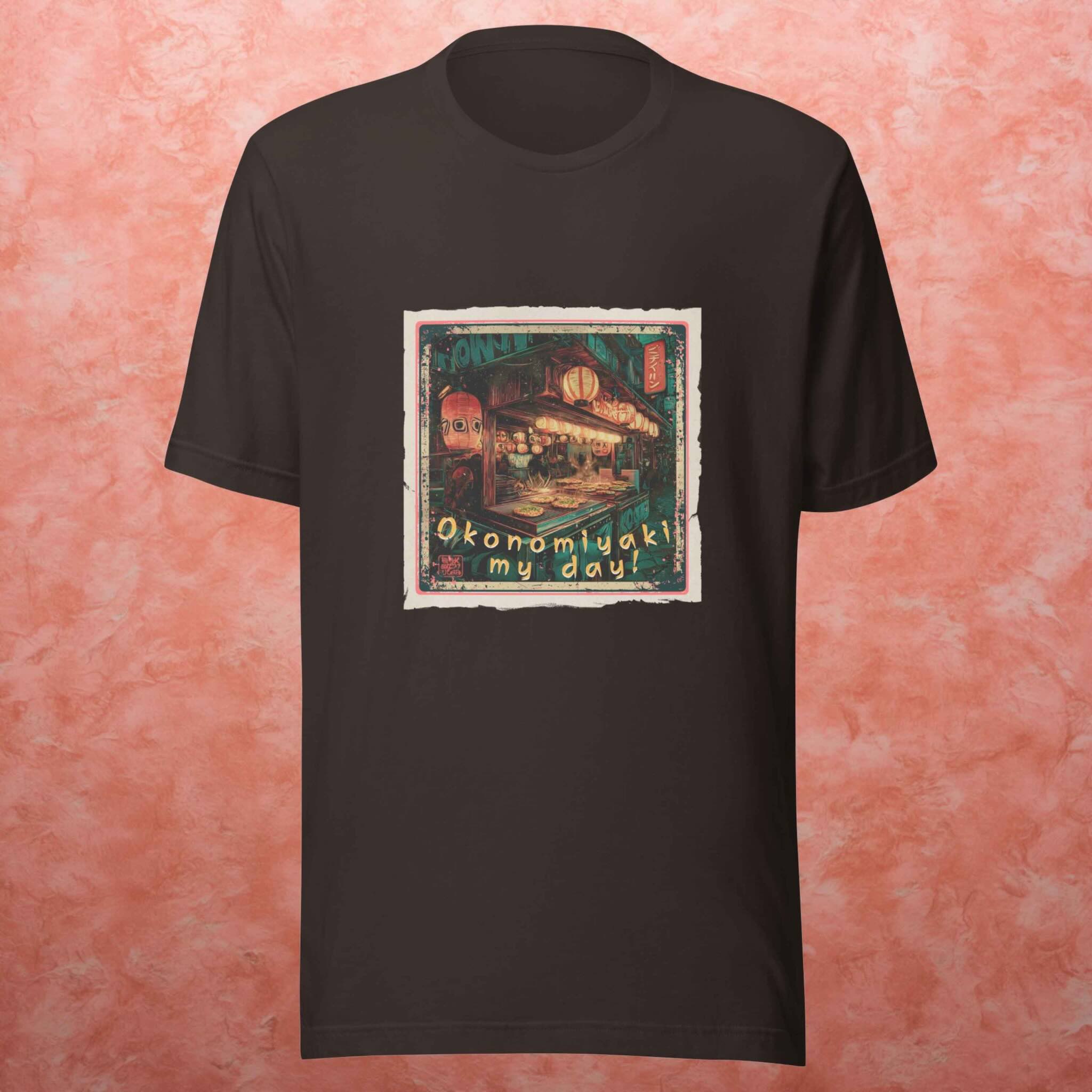 Black t-shirt with a okonomiyaki graphic design on a pink textured background