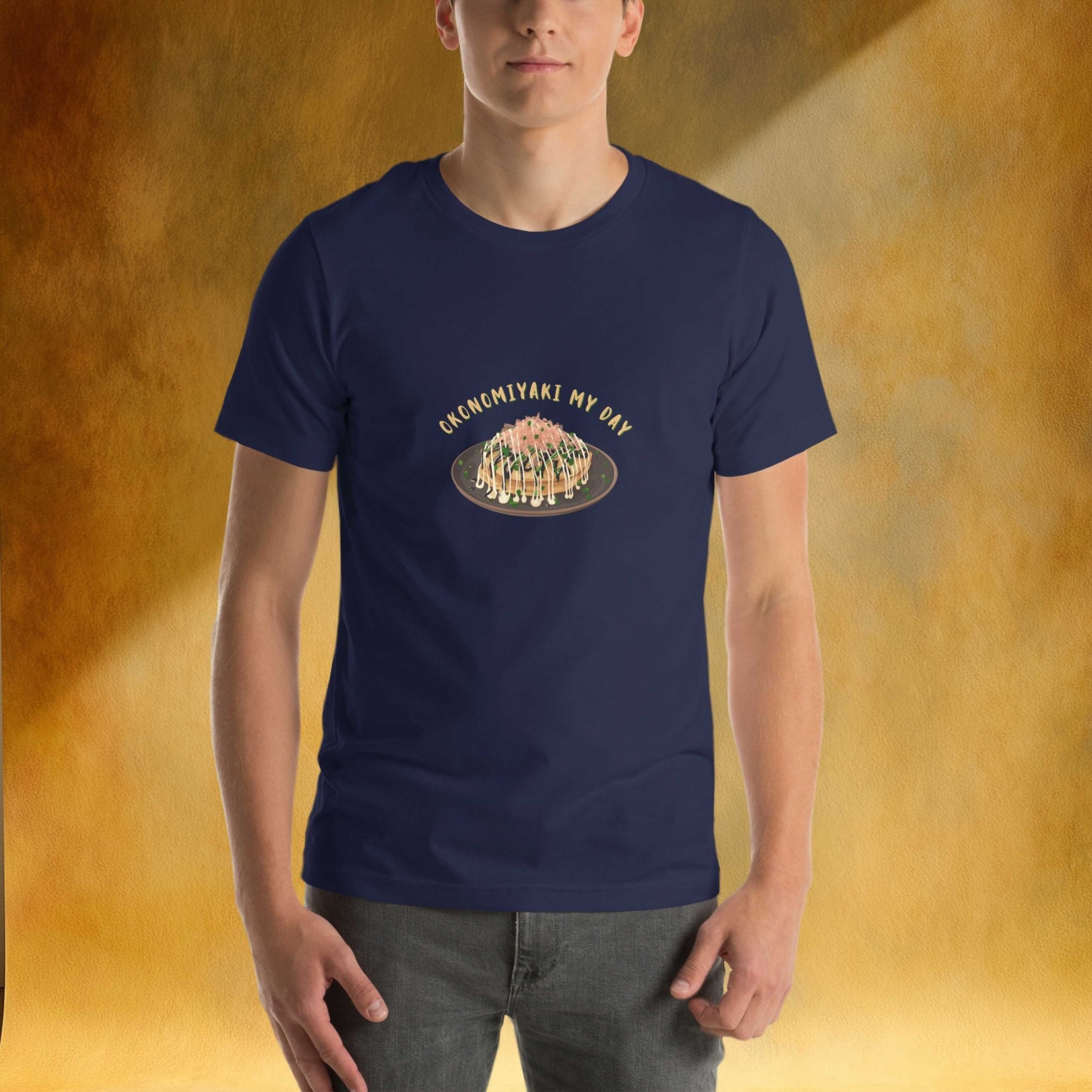 Person wearing a navy blue t-shirt with a graphic design of okonomiyaki on a yellow background