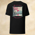 Black t-shirt with monkeys in onsen graphic design and text on the back against a beige background