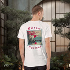 Man wearing a white t-shirt with a graphic design and text in a japanese outdoor setting