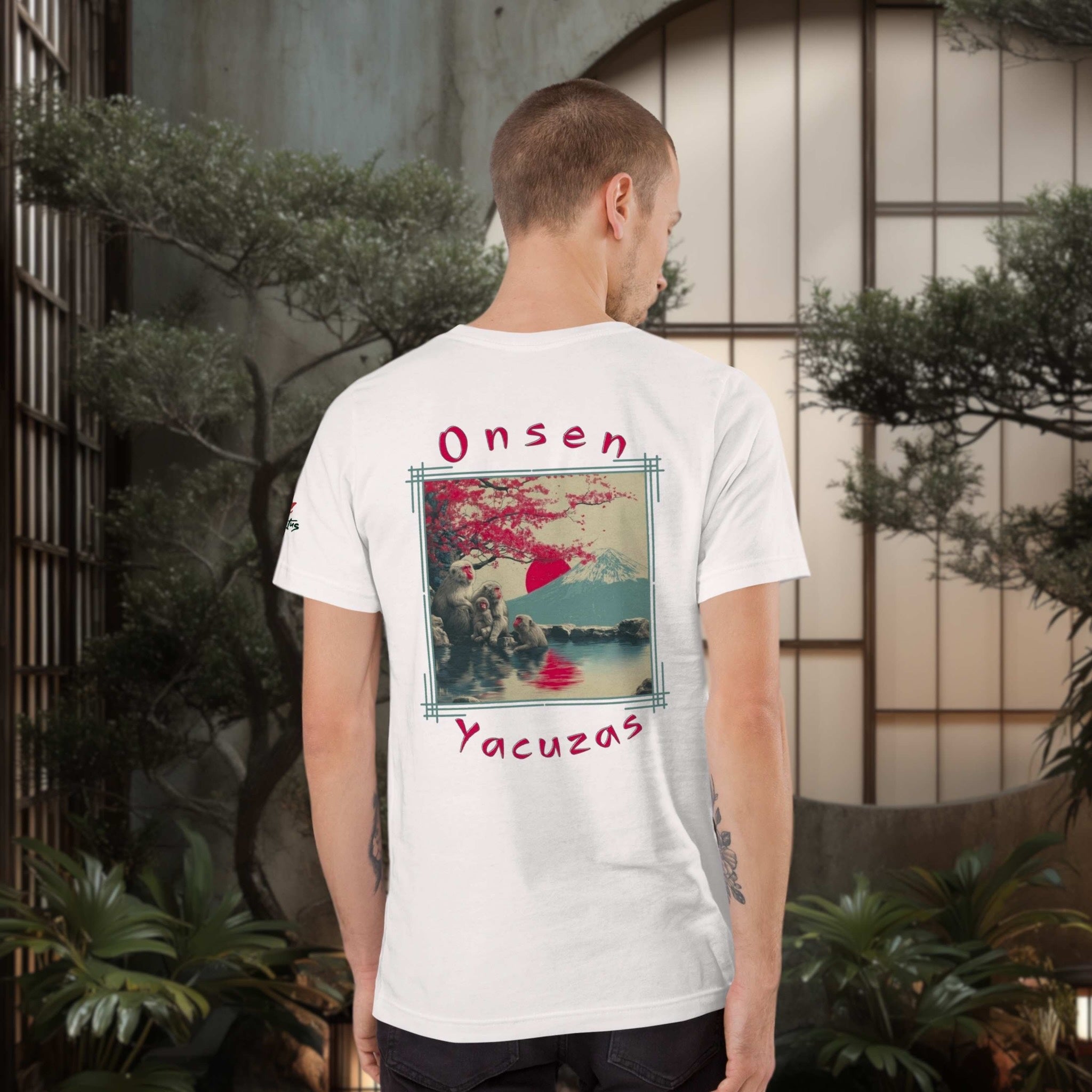 Man wearing a white t-shirt with a graphic design and text in a japanese outdoor setting