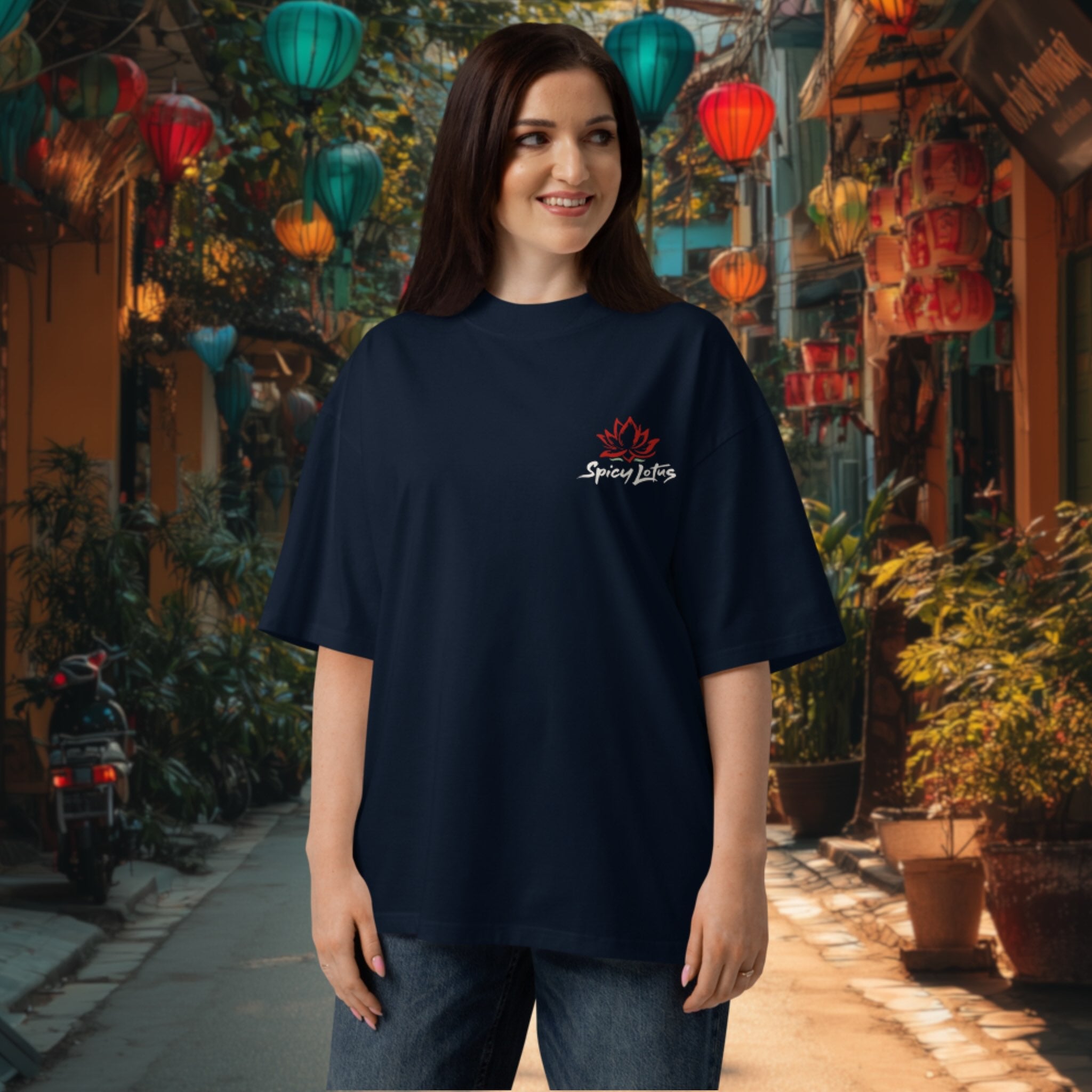 Woman wearing a black oversized What the Pho tee  with a chest  logo in an outdoor setting with colorful lanterns in Hoi An, Vietnam