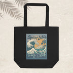 Black tote bag with 'Spicy Lotus Surf Club' design on a beige background