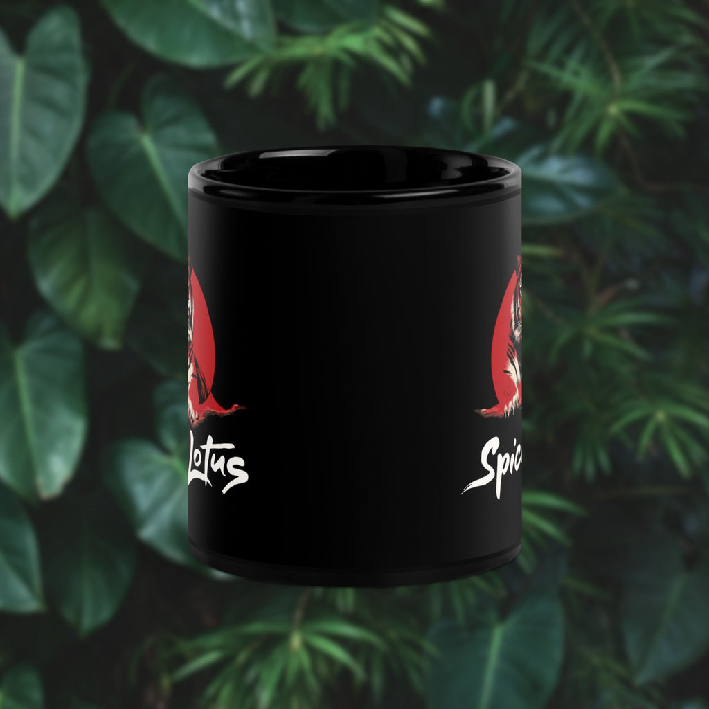 Black mug with red tiger design and text on a green leafy background