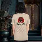 Person wearing a beige t-shirt with a tiger graphic and 'Spicy Lotus' text, standing in an ornate room.