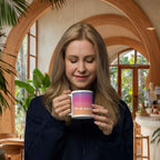 Woman holding a mug with text in a cozy indoor setting
