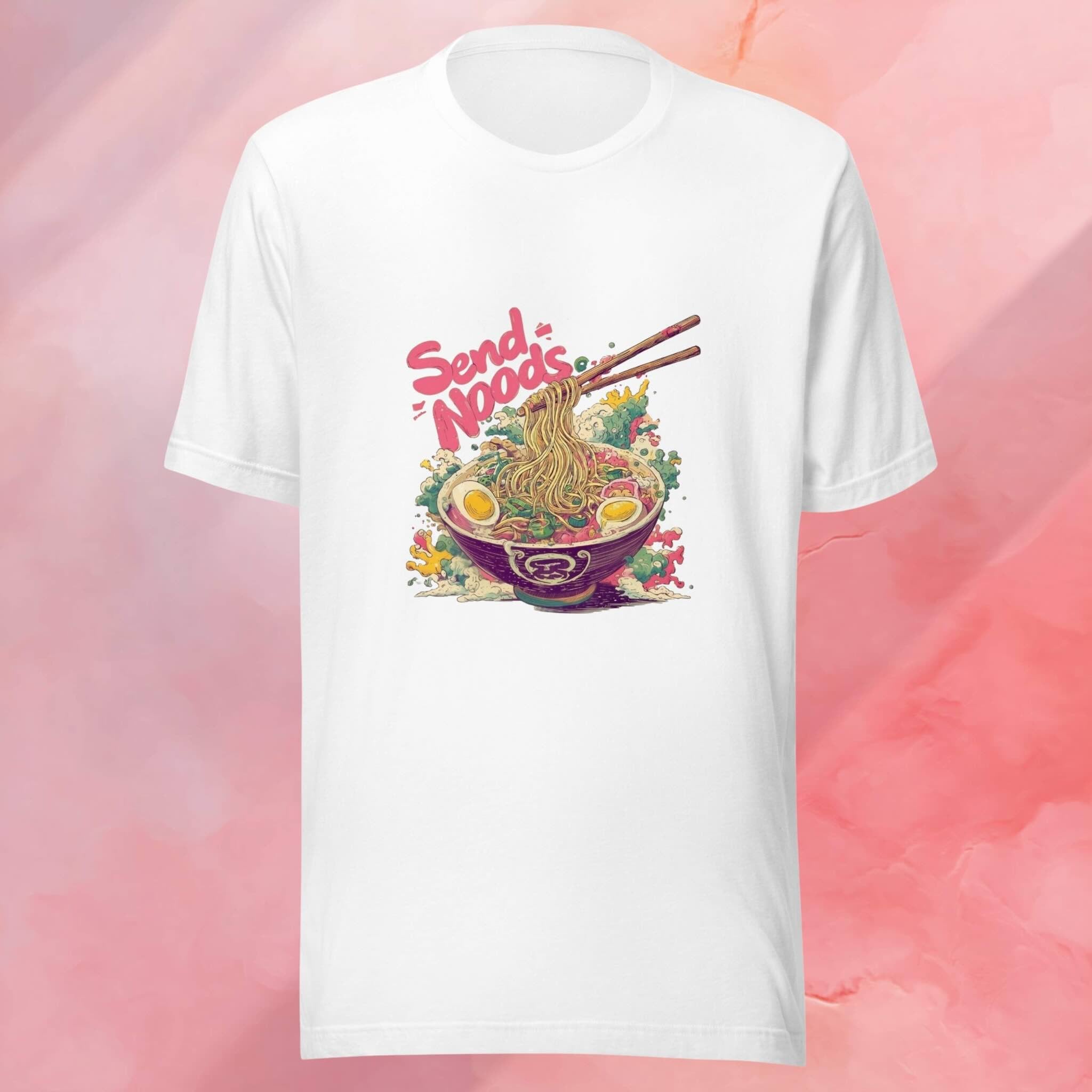 White t-shirt with a colorful graphic of noodles and chopsticks on a pink background