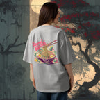 Female model wearing a gray t-shirt with a colorful graphic of ramen noodles on the back, standing in front of a stylized tree and moon background, japanese style