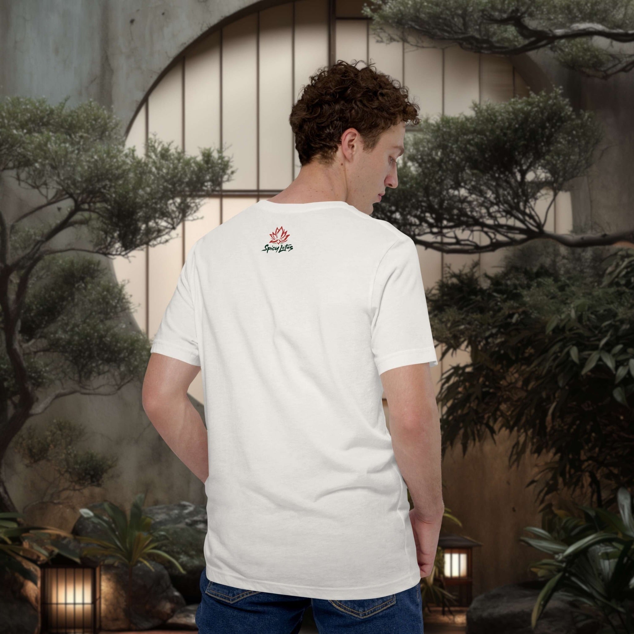 Person wearing a white t-shirt with a logo in a japanese outdoor setting with plants and lanterns.