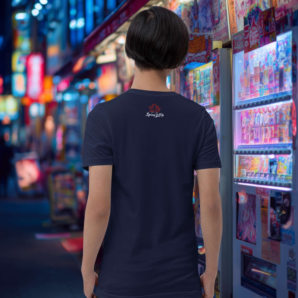 Person wearing a dark blue t-shirt with a Spicy Lotus logo, standing in front of a colorful vending machine at night.