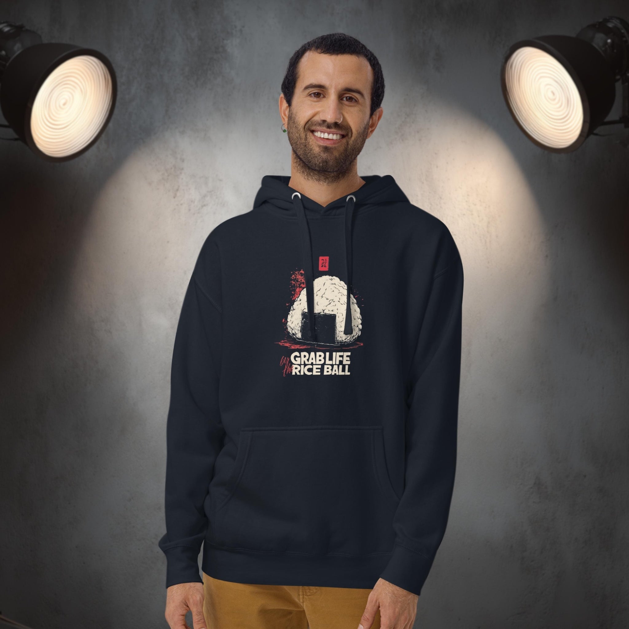 Model wearing Grab Life by the Rice Ball hoodie in clean studio setting