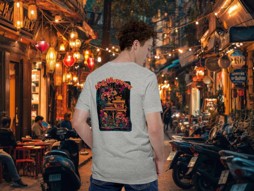 Person wearing a t-shirt with a colorful design of geckos in a lively street setting in Southeast Asia